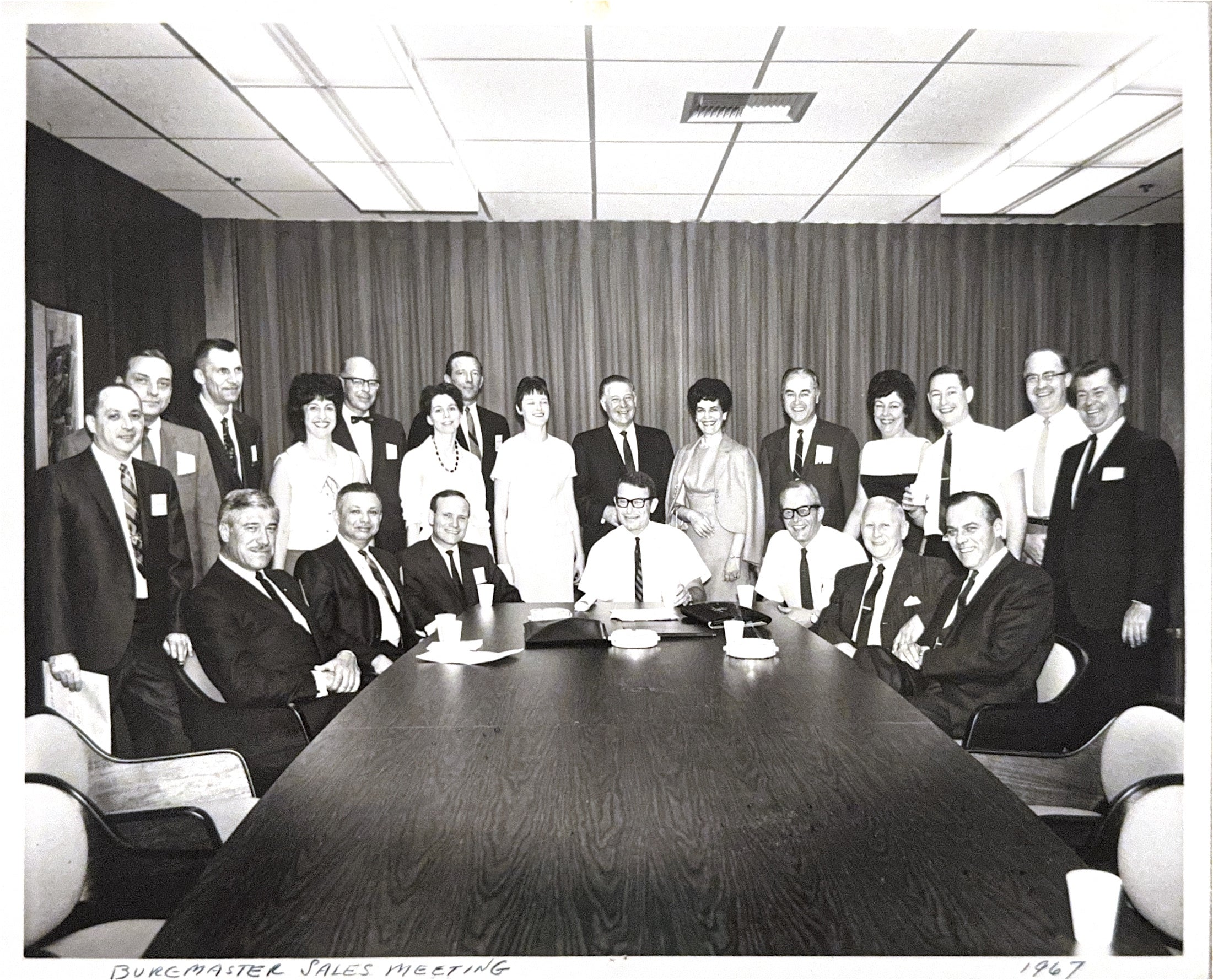 1967 Burgmaster Sales Meeting with Noah Letsky seated in the front row, second from left, and Betty Jane Letsky standing behind him.